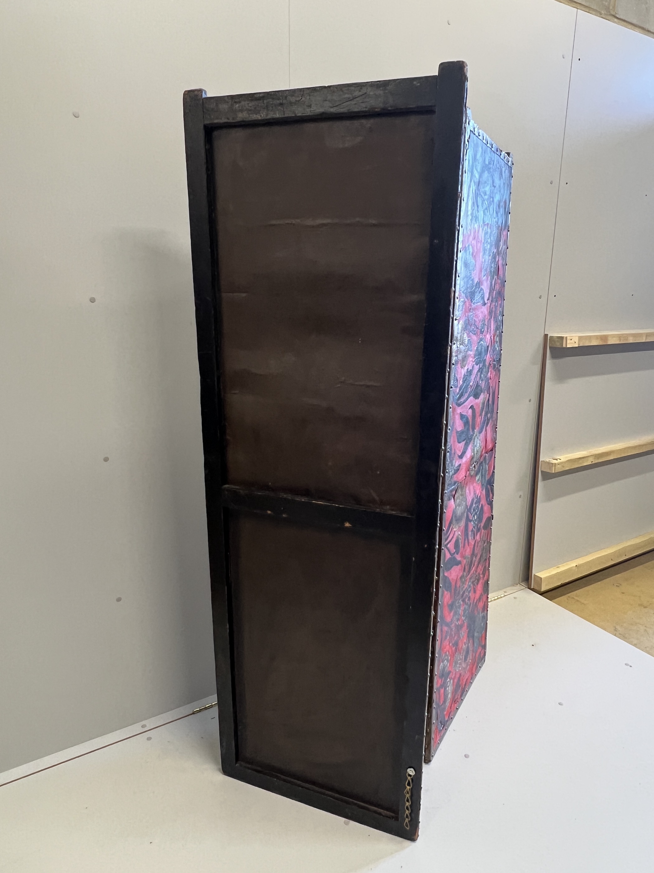 A 19th century Spanish leather three fold dressing screen re-painted by Ricardo Cinalli for the current owner, each panel width 57cm, height 175cm